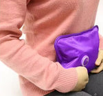 Electric hot water bottle being held
