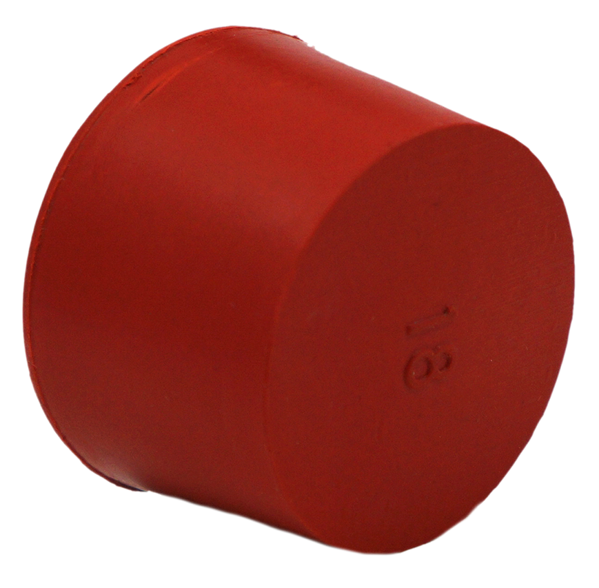 Tuning fork being struck on a red rubber puck activator