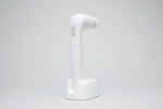 White DAS NOVAFON sound wave device with disk attachment, upright in its charging stand