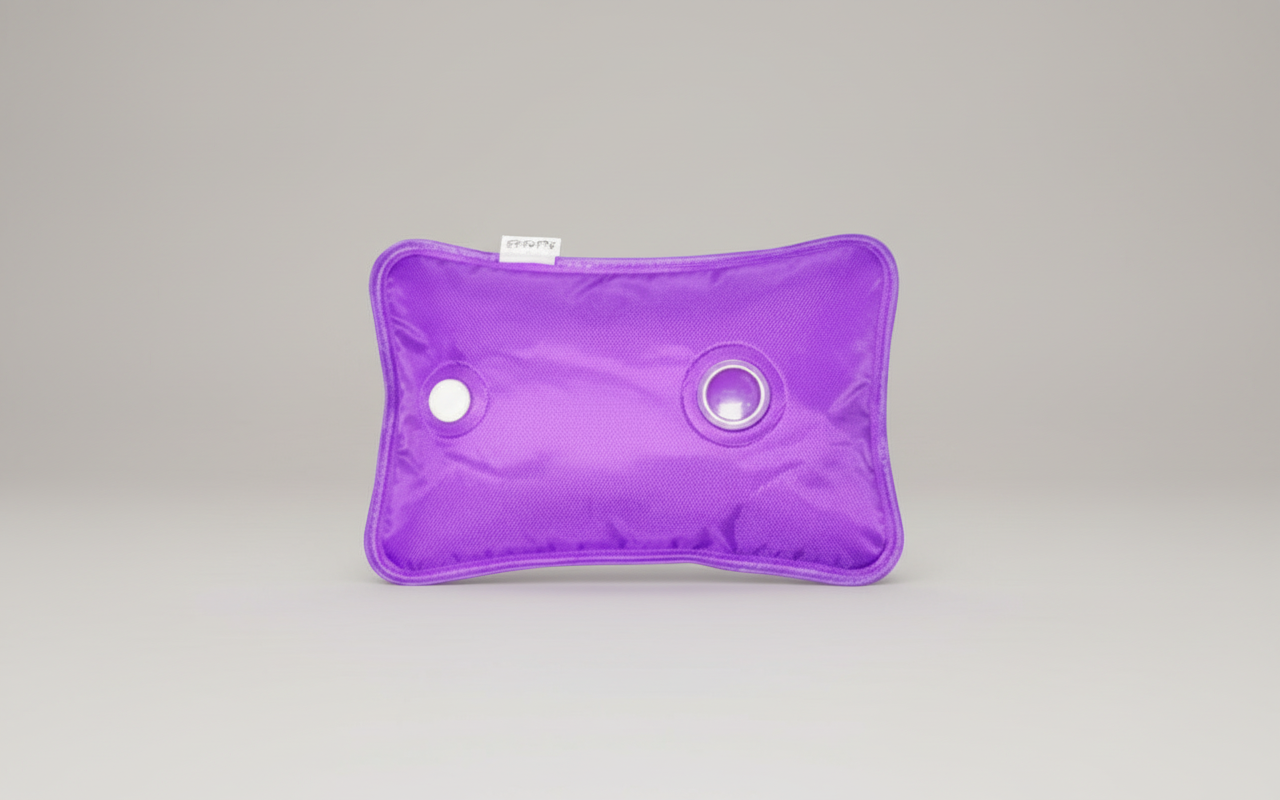 Electric hot water bottle product flat lay