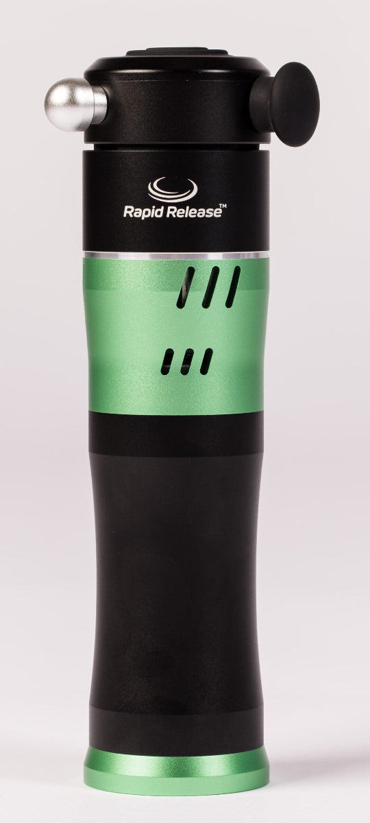 Rapid Release Traveler vibration therapy device standing upright, with silver ball and black applicators