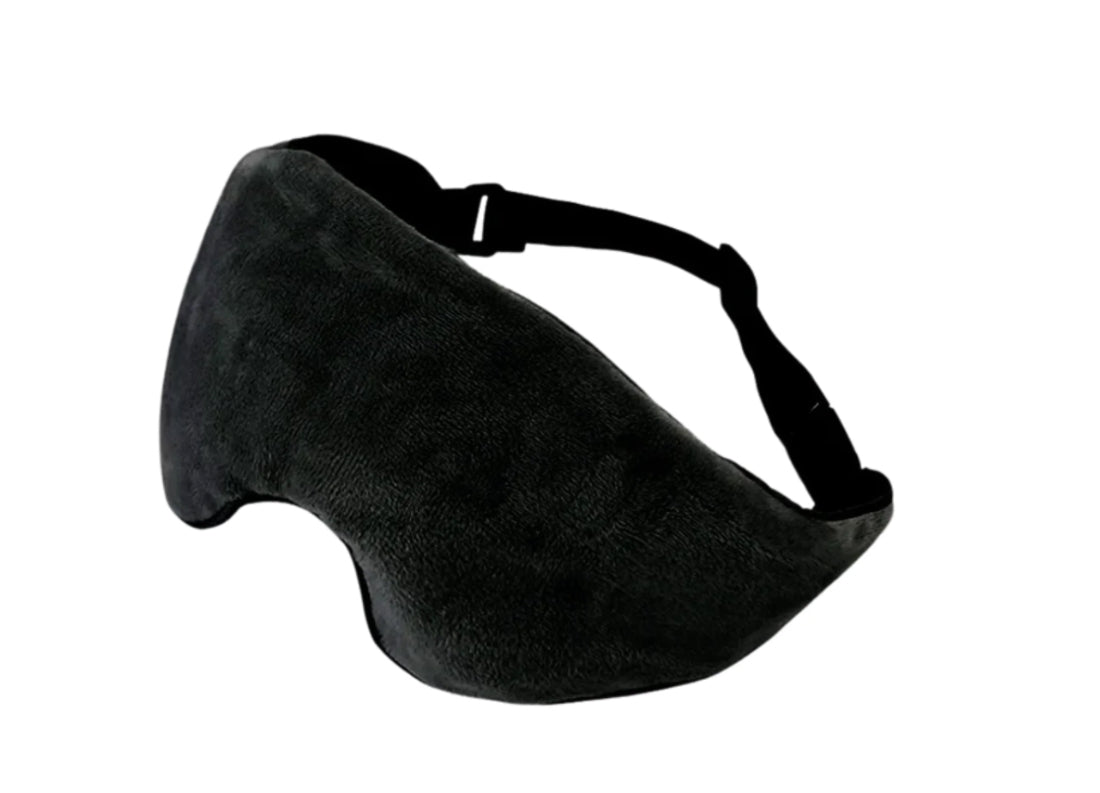 Black weighted eye pillow with contoured nose cutout and adjustable strap for sleep and relaxation