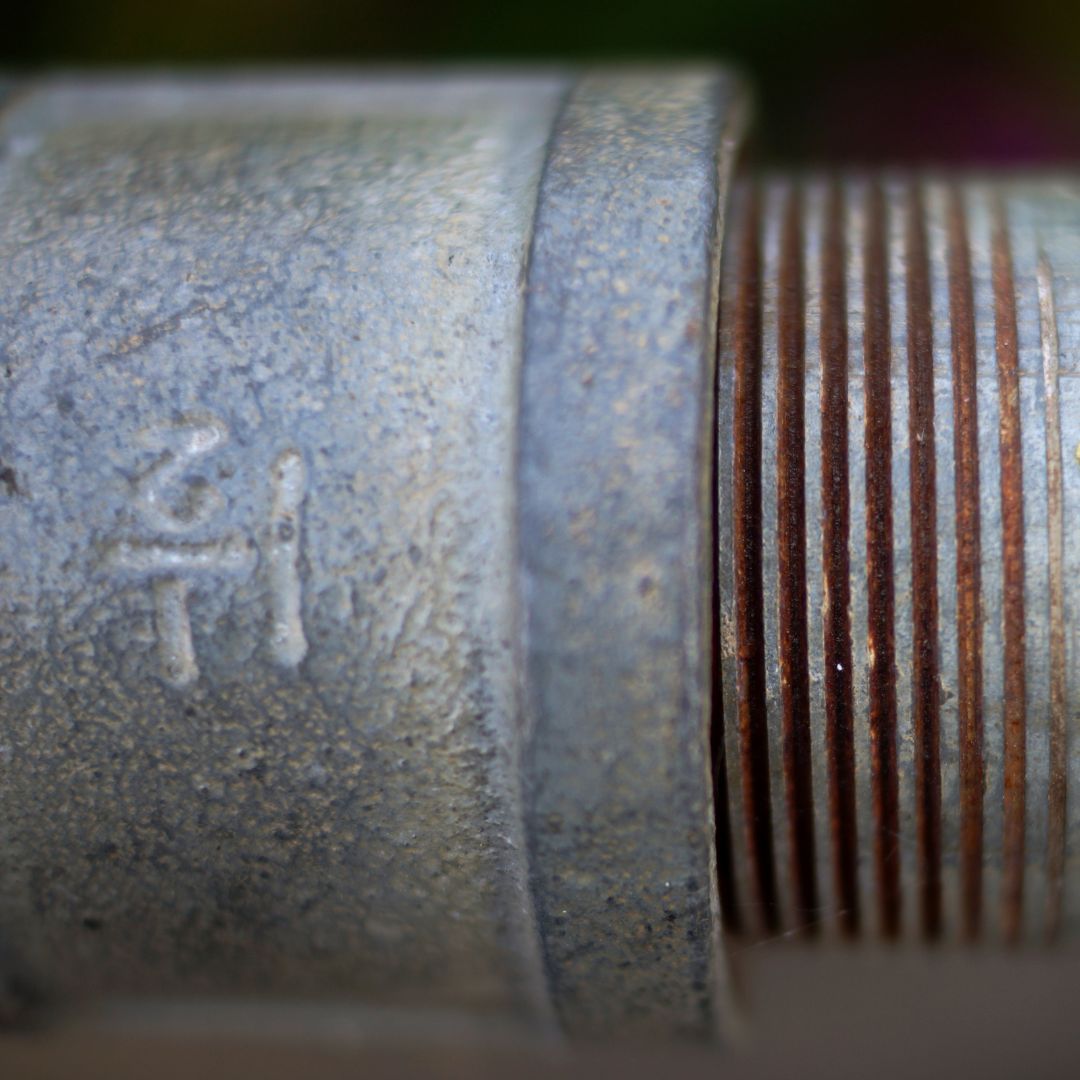 close up of a lead pipe plumbing