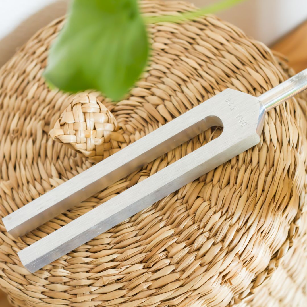 tuning fork laid on a wicker table