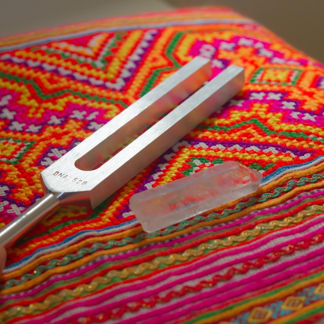 tuning forks on colorful blanket 