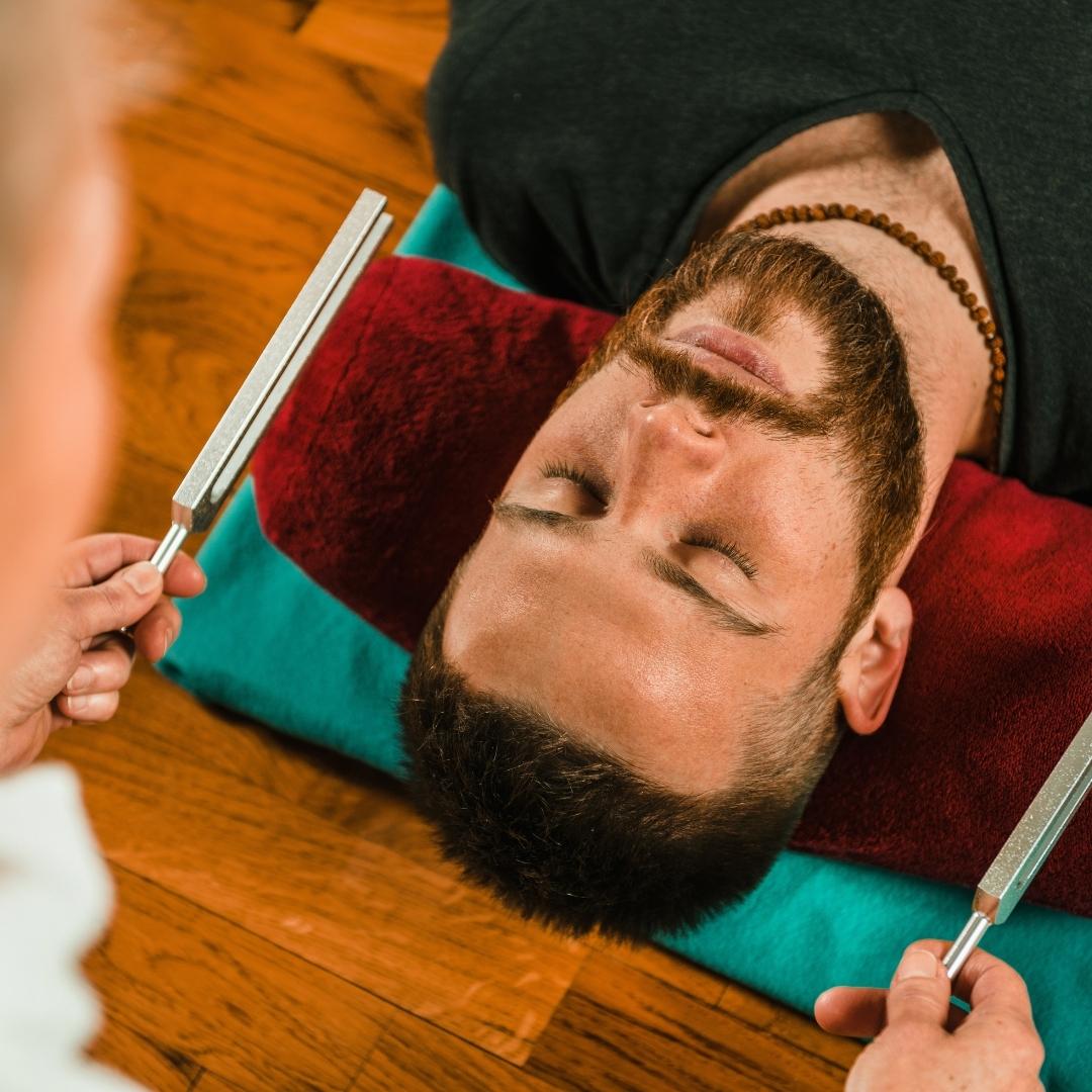 using tuning forks on man